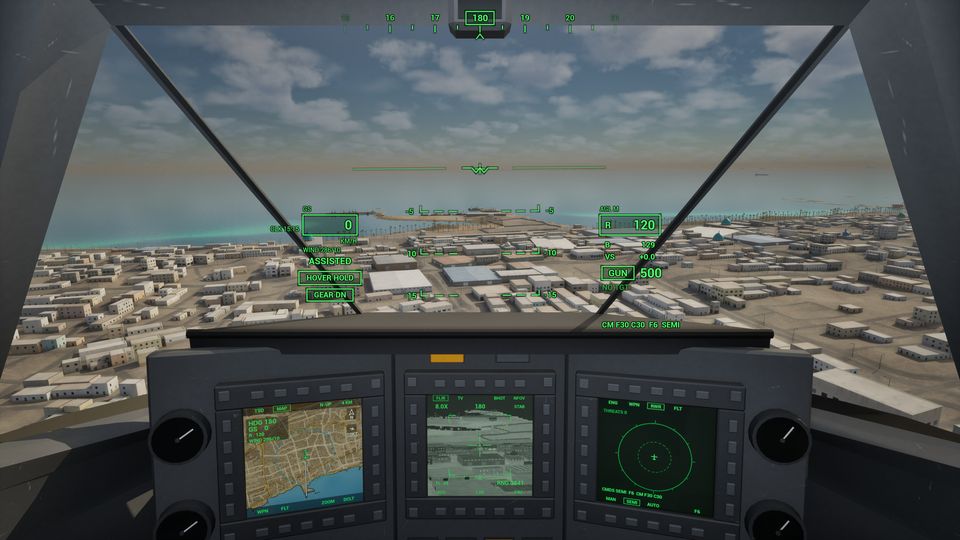 RAH-66 cockpit in daylight: green head-up display symbology over a coastal town and three multifunction displays below