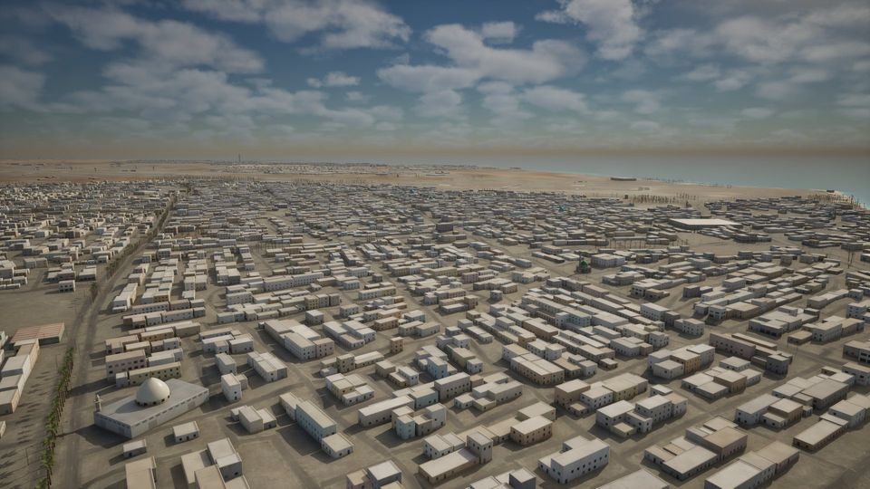 The town of Bushehr from the air, low-rise houses filling the peninsula